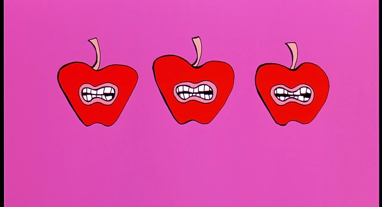 Viva (2007) movie still: wide — Three identical red apples with anthropomorphic mouths and teeth float in a blank space. The background is a solid,…