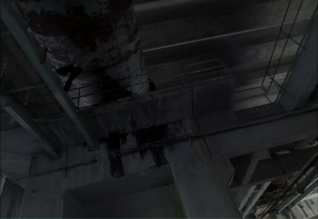 Ambushed (1998) movie still: wide — A dark concrete highway overpass features heavy structural pillars and massive rust-stained piping. The…