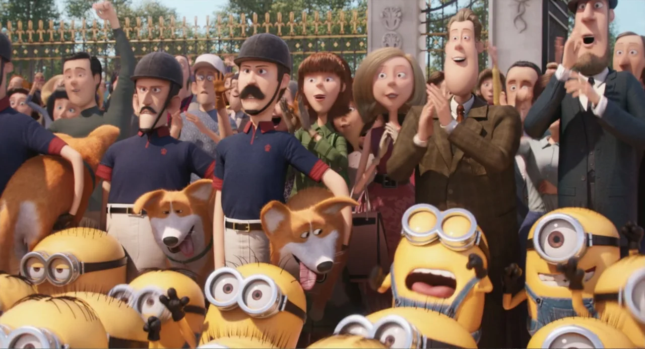 Minions (2015) movie still: medium — A diverse crowd of people and yellow minions stand before a large ornamental metal gate. The crowd cheers and…
