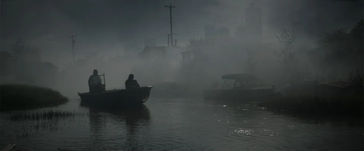 Godzilla (2014) movie still: wide — A dense fog obscures a murky waterway with silhouettes of two boats present. Two people are traveling in a small…