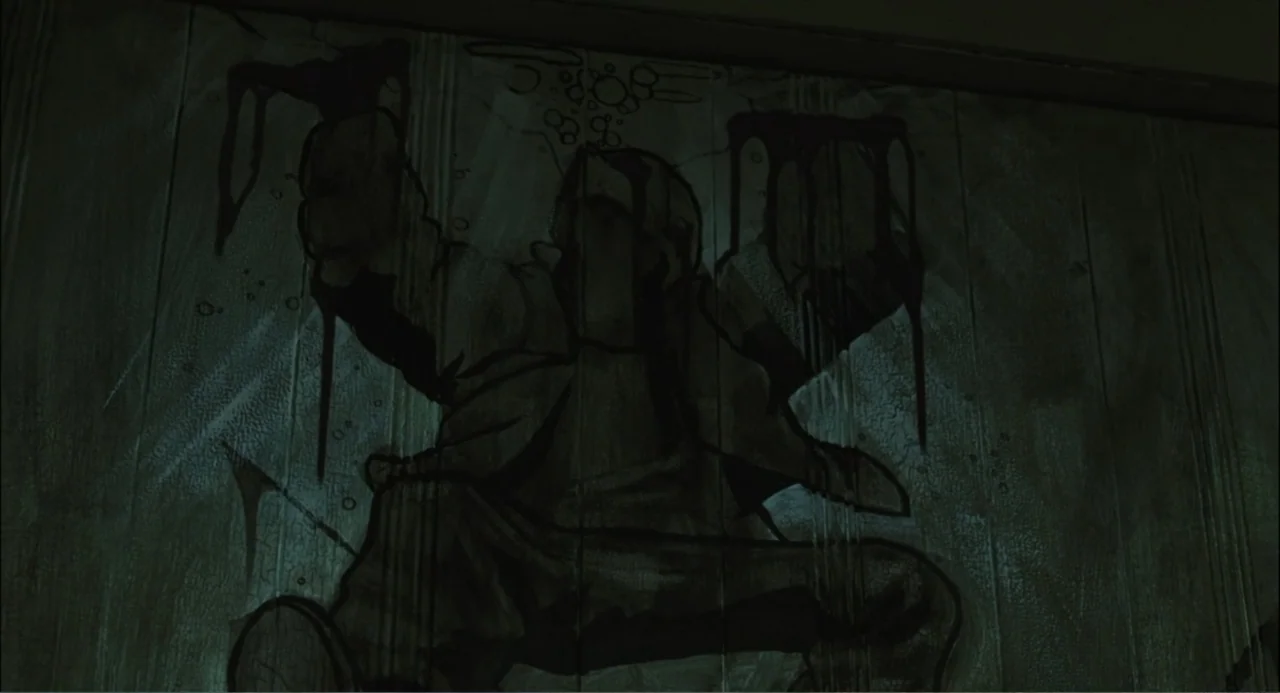 El hijo del diablo (1966) movie still: closeup — A rough interior wall features a dark, drippy painted silhouette of a human figure. The paint…