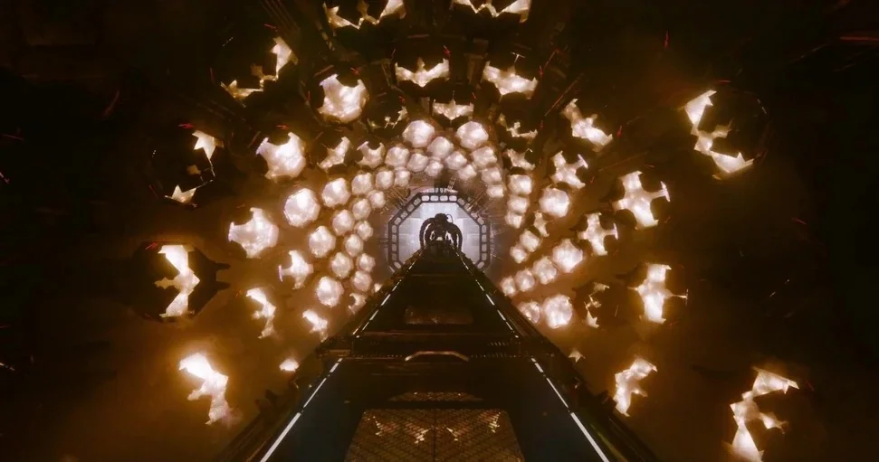 Guardians of the Galaxy Vol. 3 (2023) movie still: wide — A long cylindrical tunnel features a spiral arrangement of glowing polygonal light…