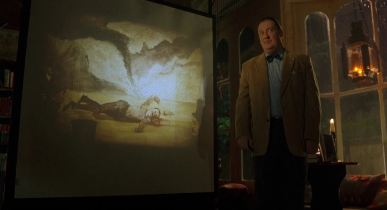 Candyman: Farewell to the Flesh (1995) movie still: medium — A dimly lit room features a large projection screen displaying a dark historical image.…