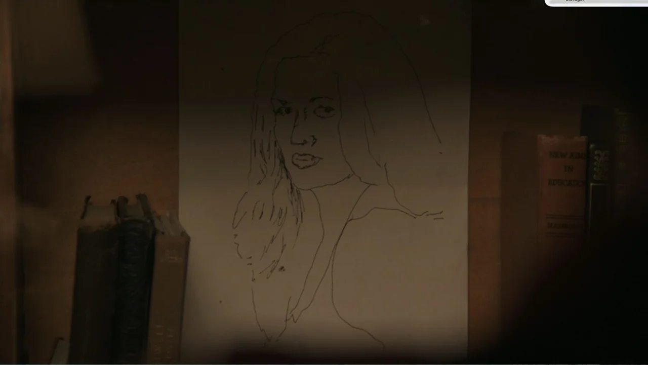 Don't Worry, He Won't Get Far on Foot (2018) movie still: closeup — A close-up of a charcoal sketch on paper displayed inside a dark bookshelf. The…