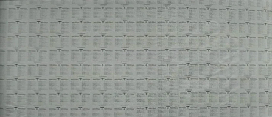 And The Fifth Horseman is Fear (1965) movie still: establishing — A flat wall is covered with a repeating grid of printed administrative documents.…