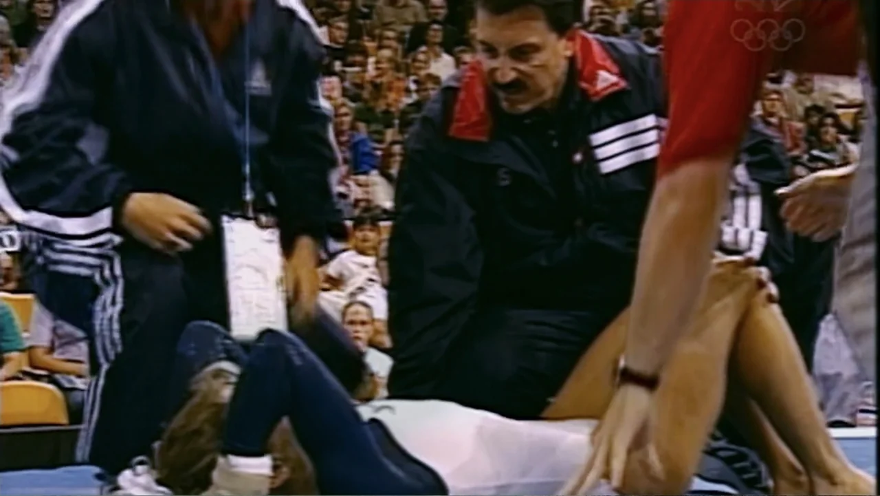 At the Heart of Gold: Inside the USA Gymnastics Scandal (2019) movie still: medium — A sports gymnasium floor filled with spectators in the…