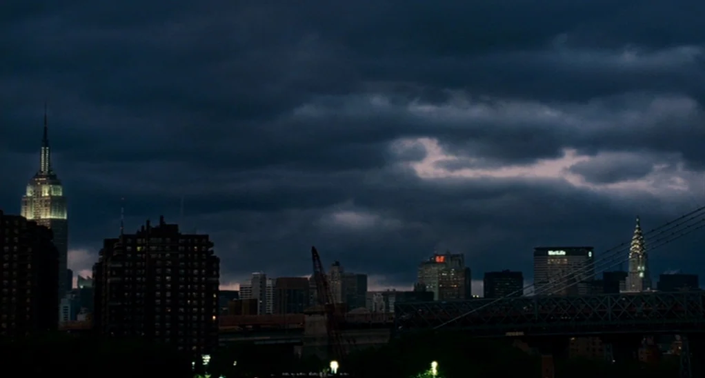 The Adjustment Bureau (2013) movie still: establishing — A wide view of the Manhattan skyline features the Empire State and Chrysler buildings.…
