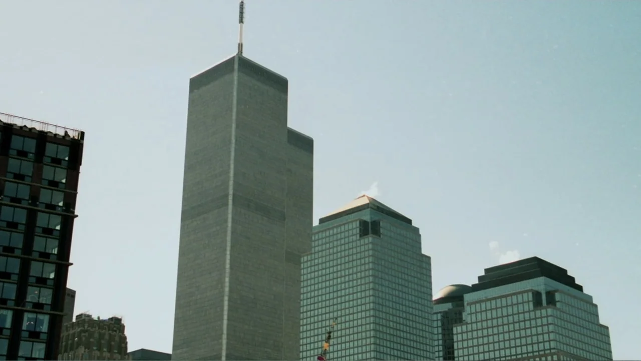In the Shadow of the Towers: Stuyvesant High on 9/11 (2019) movie still: establishing — A low-angle view of the Twin Towers and adjacent Lower…