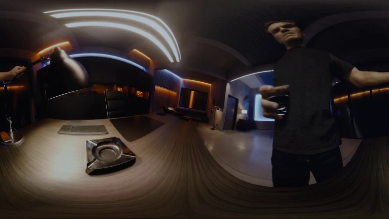 Fahrenheit 451 (2018) (2018) movie still: medium — A modern executive space with a dark desk and integrated architectural lighting. A man stands at…