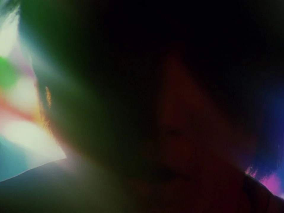 Throw Away Your Books, Rally in the Streets (1971) movie still: closeup — An abstract, dark composition dominated by large, multicolored optical…