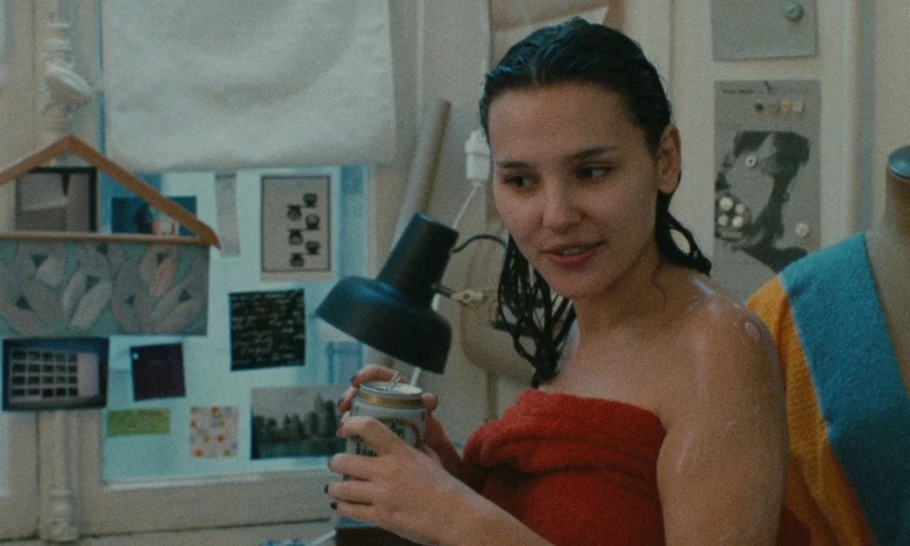 Late August, Early September (1998) movie still: medium — A cluttered room interior with windows covered in various small photographs and notes. A…