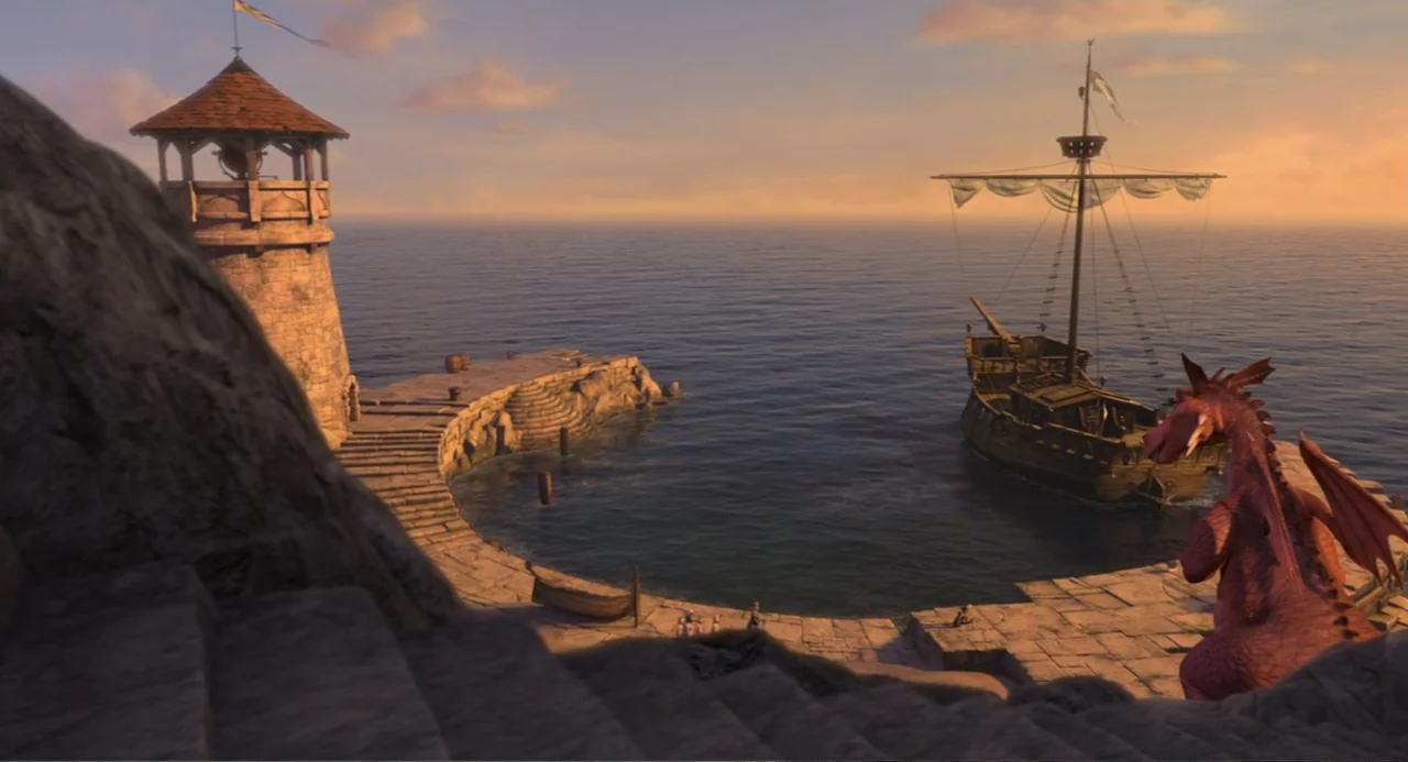 Shrek the Third (2007) movie still: wide — A stone lighthouse stands at the edge of a curved masonry pier by water. A wooden sailing ship is moored…