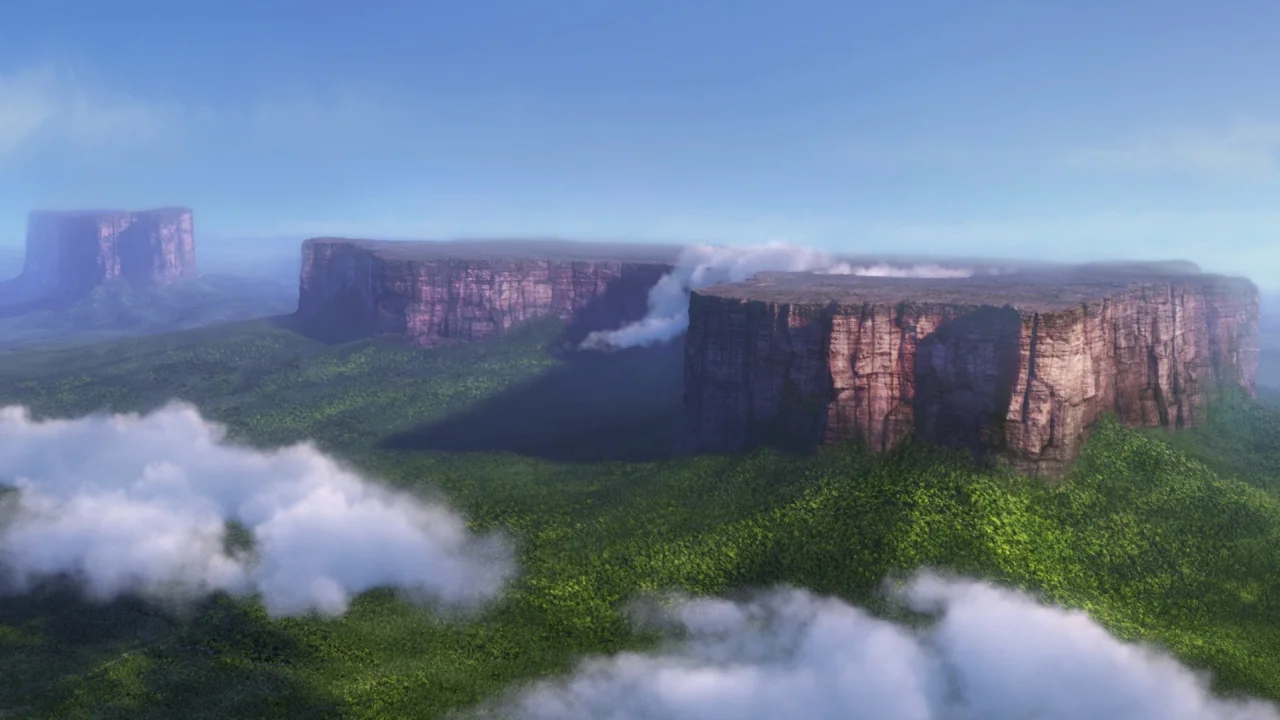 Up (2009) movie still: establishing — Flat-topped mountains rise above a vast, dense green jungle floor under a blue sky. Wispy white clouds float…