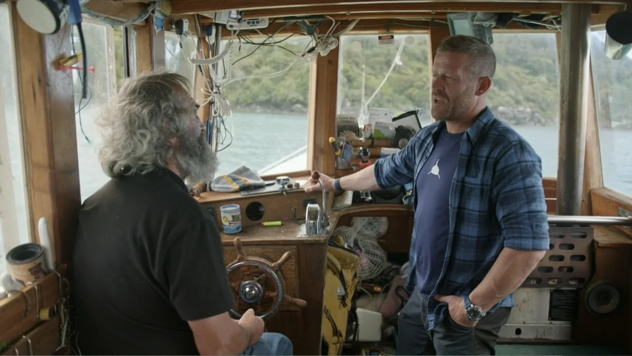 Air Jaws: Final Frontier (2023) movie still: medium — The interior of a wooden boat cabin shows clutter including nautical instruments and tools. A…