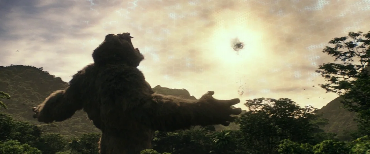 Godzilla Vs. Kong (2021) movie still: wide — A dense, mountainous tropical landscape filled with lush greenery and thick jungle vegetation. A…