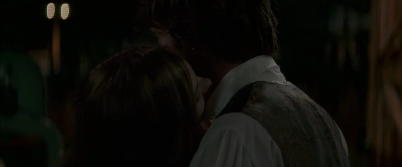 If I Stay (2014) movie still: closeup — A dark outdoor setting at night features two figures standing very close together. A woman rests her head…
