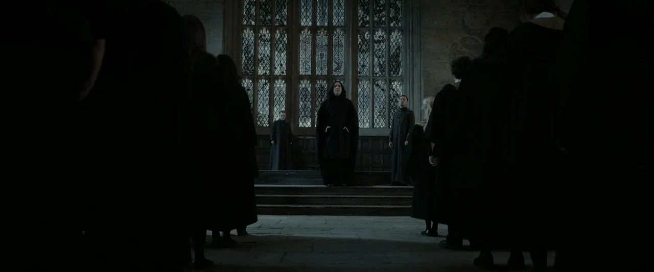 Harry Potter & The Deathly Hallows Part 2 (2011) movie still: wide — A stone interior space features a large gothic arched window with leaded glass…