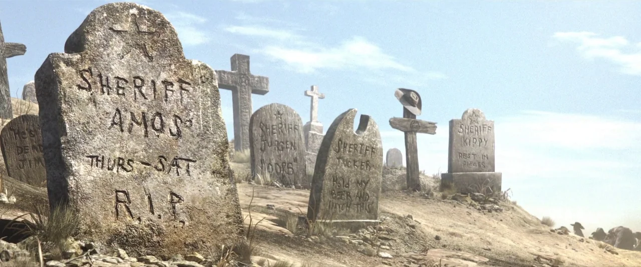 Rango (2011) movie still: wide — A dry, dusty hillside cemetery features rows of weathered stone markers and wooden crosses. Multiple carved…