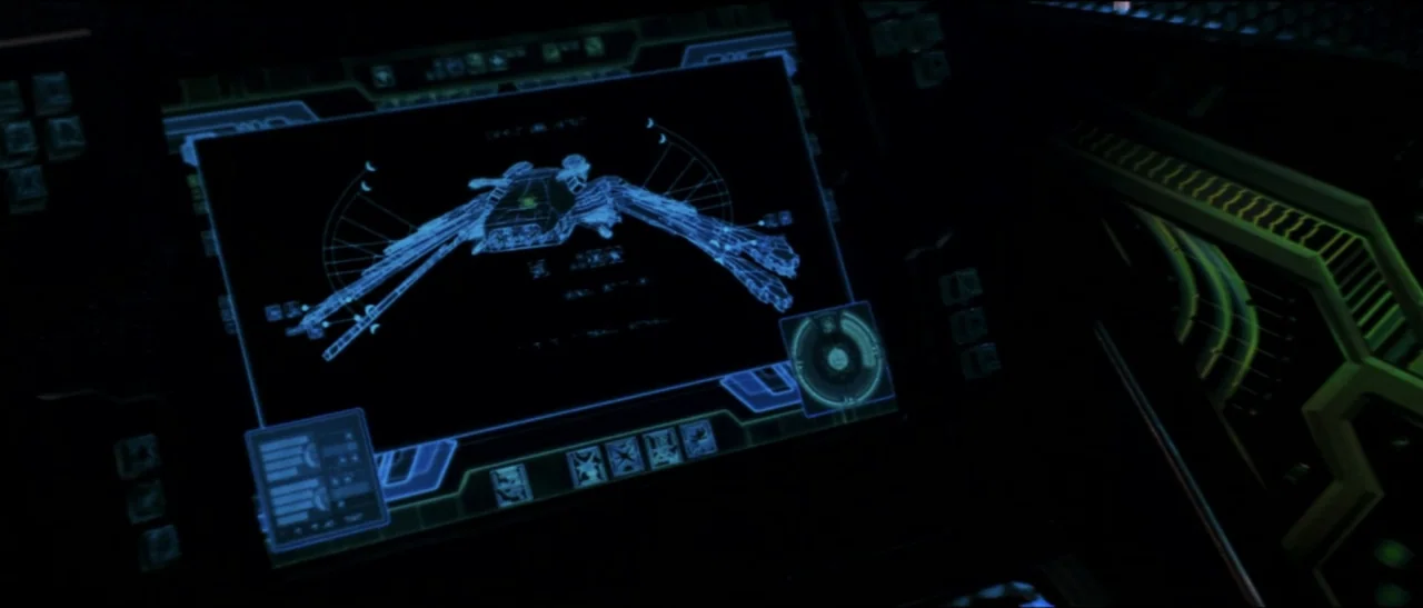 Star Trek: Nemesis (2002) movie still: closeup — A high-tech digital monitor displays a detailed blue schematic of a spacecraft. The screen serves…