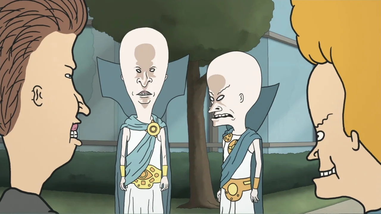 Beavis and Butt-Head Do the Universe (2022) movie still: medium — An outdoor area with a tree and blue glass walls in the background. Two teenagers…