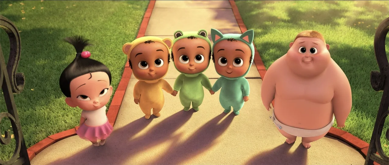 The Boss Baby (2017) movie still: fullbody — Five infants stand on a concrete sidewalk bordered by green lawns in sunlight. The group consists of…