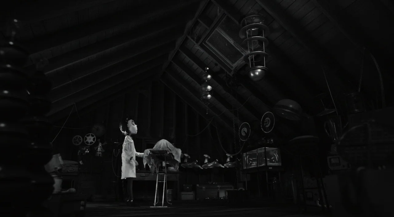 Frankenweenie (2012) movie still: wide — A cluttered attic contains various mechanical scientific equipment and a small workbench. A young boy in a…
