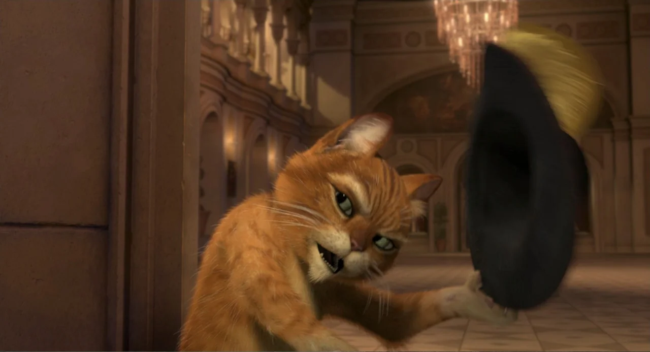 Shrek 2 (2004) movie still: medium — An interior shot features a large ballroom with arched walkways and a prominent chandelier. An orange tabby cat…