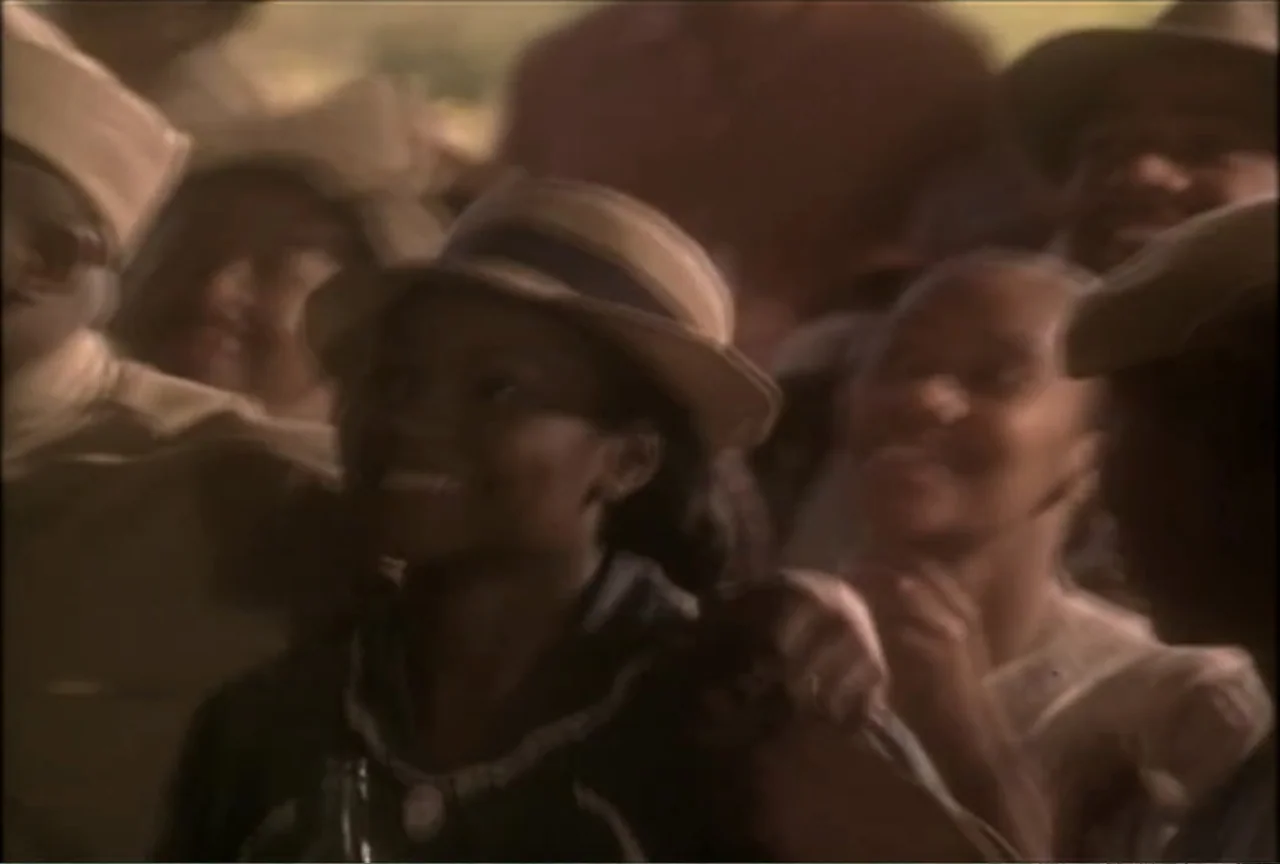 Miss Evers' Boys (1997) movie still: medium — A group of people are gathered together outdoors in the 1930s. They look upwards with expressions of…