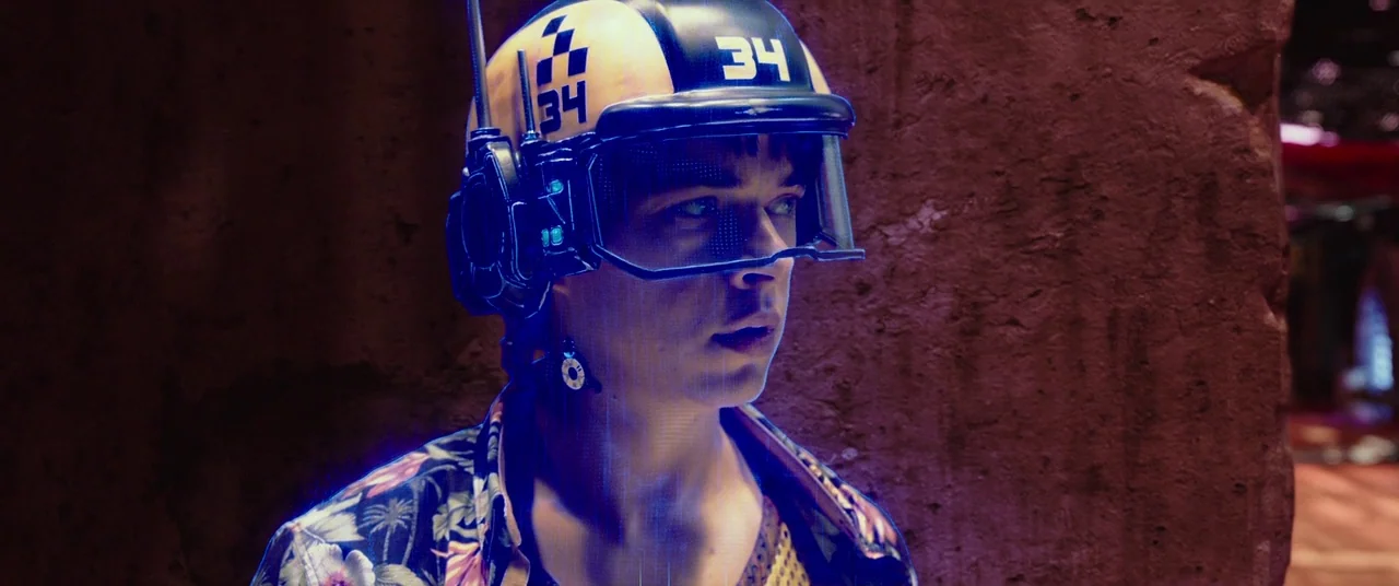 Valerian and the City of a Thousand Planets (2017) movie still: closeup — A dimly lit narrow corridor features textured dark red walls and metallic…