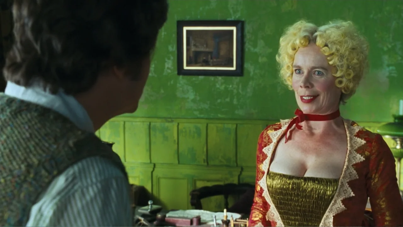 Nanny McPhee and the Big Bang (2010) movie still: medium — A study with bright green paneled walls and a small painting hung centrally. A woman in…