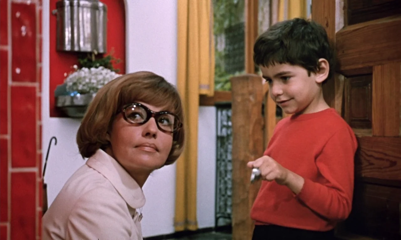 The Bride Wore Black (1968) movie still: medium — A residential interior features red wall tiles and yellow fabric drapes near a wooden panel. A…