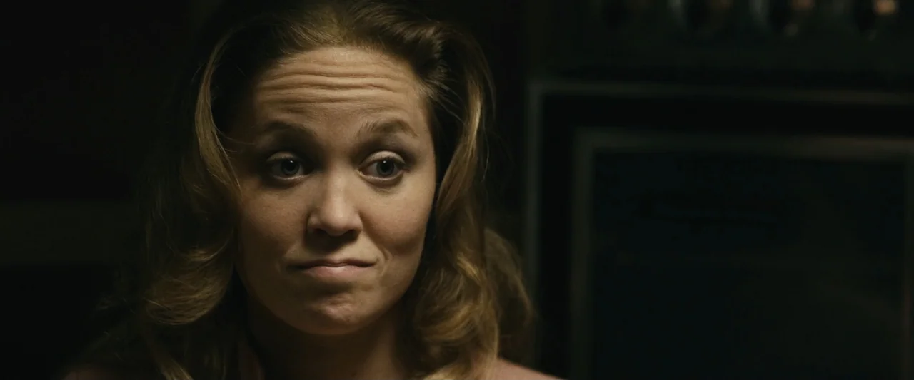 The Case for Christ (2017) movie still: closeup — A dark kitchen interior with an out-of-focus appliance visible in the background shadow. A woman…