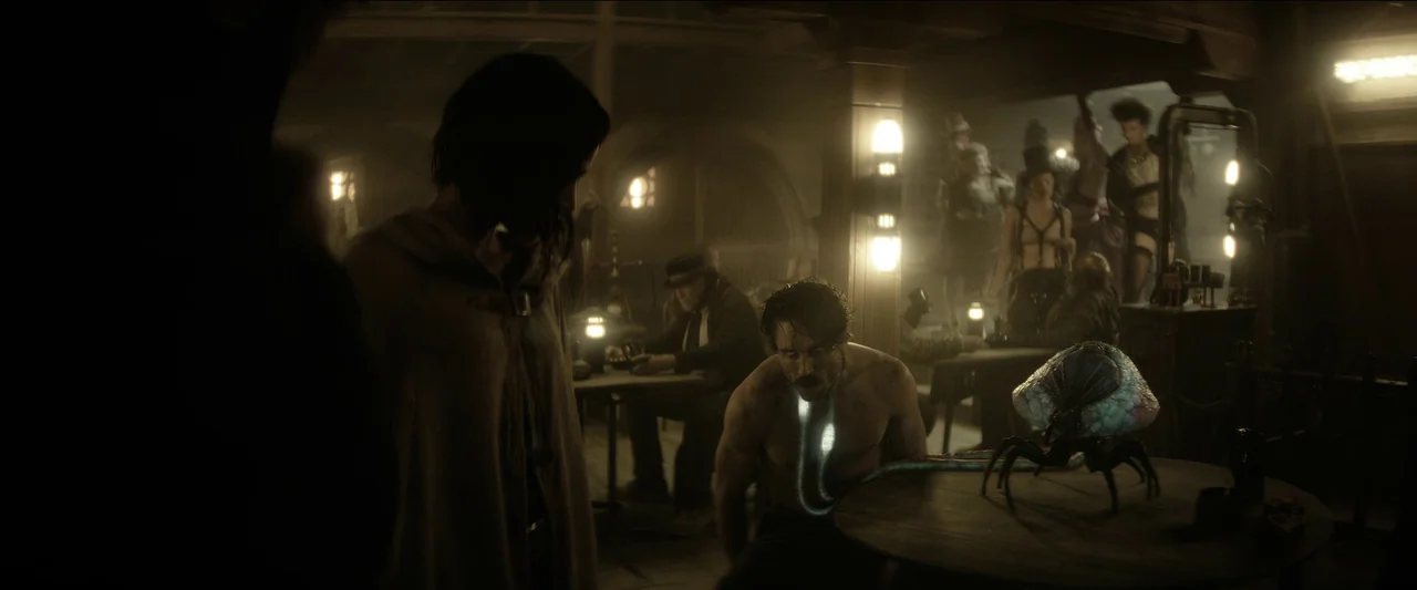 Rebel Moon – Part One: A Child of Fire (2023) movie still: medium — A dimly lit 19th-century pub with wooden beams and patrons at tables in…