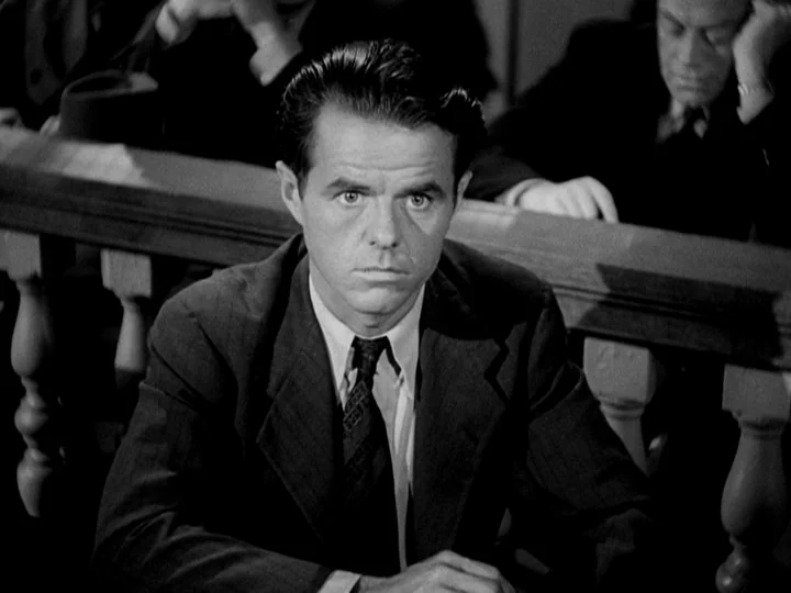 Stranger on the Third Floor (1940) movie still: medium — A courtroom interior featuring a wooden railing separating the gallery from the main area.…