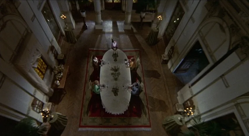 Lisa and The Devil (1973) movie still: establishing — An opulent dining hall with high ceilings and classical architectural features like fluted…