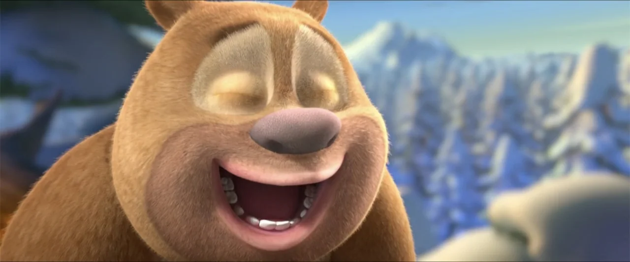 Boonie Bears: A Mystical Winter (2015) movie still: closeup — A cartoon bear's head fills the frame against a blurred snowy mountain backdrop. The…