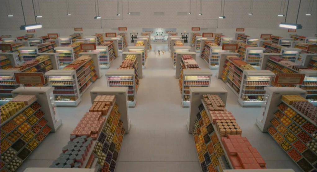 Fantastic Mr. Fox (2009) movie still: establishing — A symmetrically arranged grocery store with neat aisles containing organized product displays.…