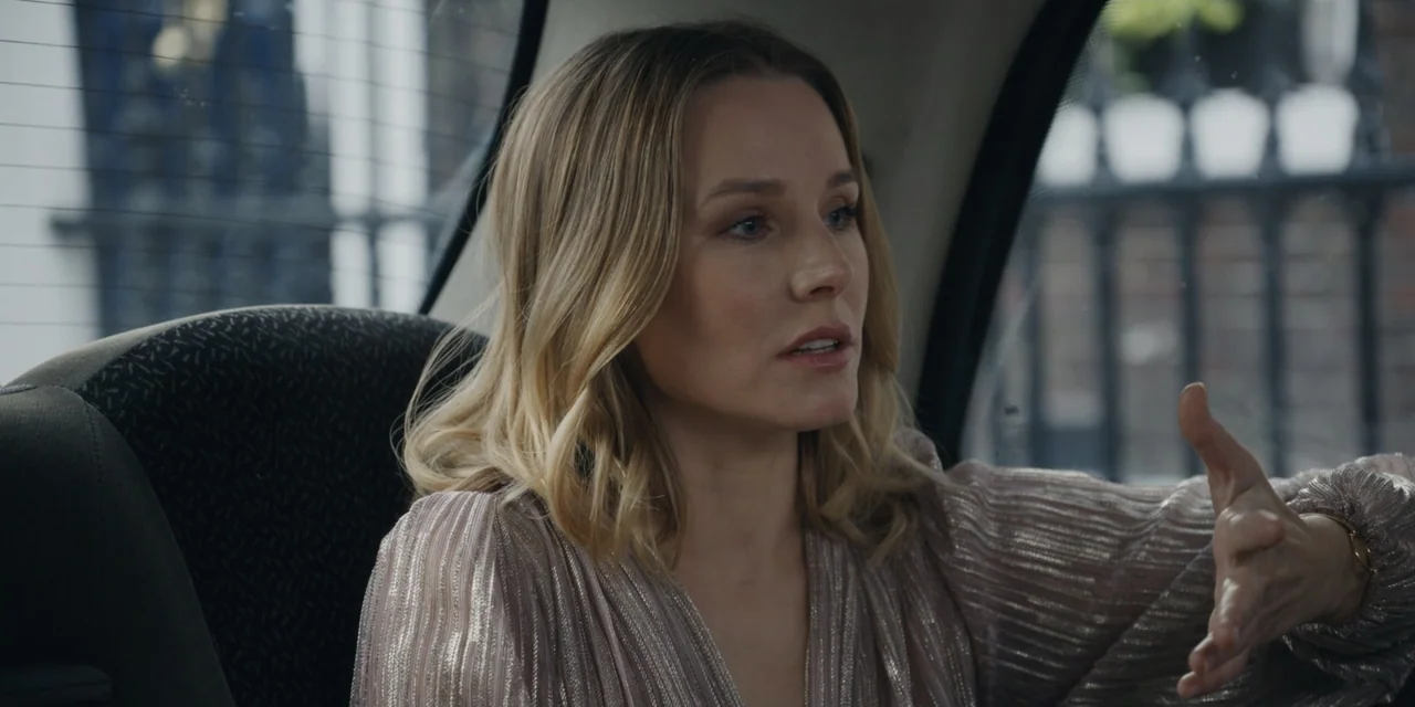 The People We Hate at the Wedding (2022) movie still: medium — A woman sits inside a car looking toward the window. She is talking while gesturing…