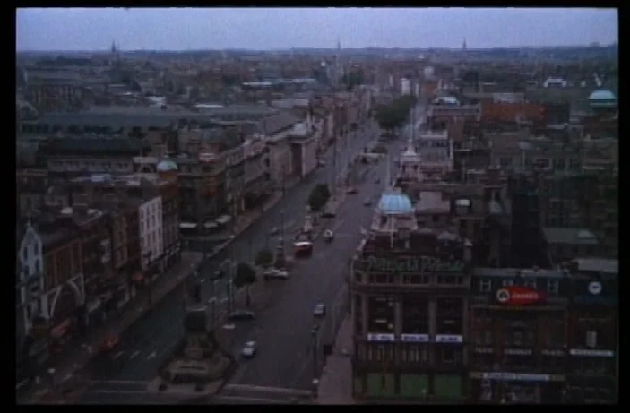 Quackser Fortune Has a Cousin in the Bronx (1970) movie still: establishing — A wide aerial view of O'Connell Street in Dublin shows Victorian…