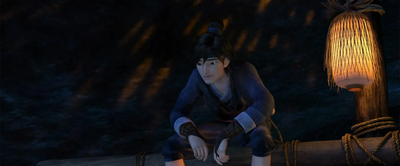 White Snake (2019) movie still: medium — A dark outdoor space near a body of water at night illuminated by a lantern. A young man sits alone on a…