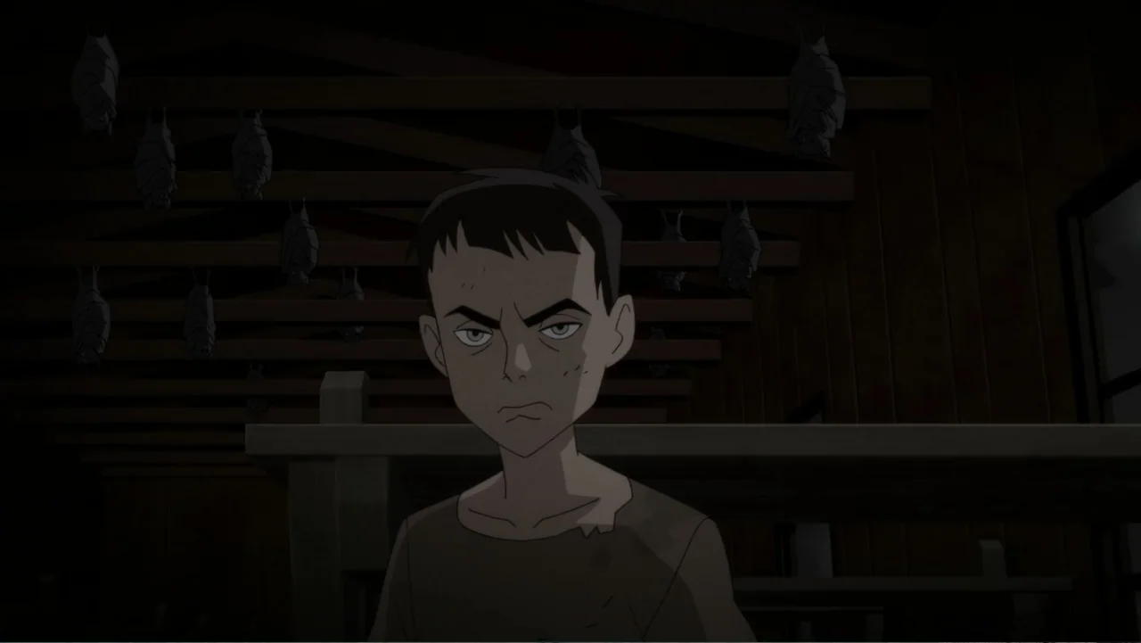 Superman: Red Son (2020) movie still: medium — A dark wooden attic interior features exposed beams and many bats hanging overhead. A young boy…