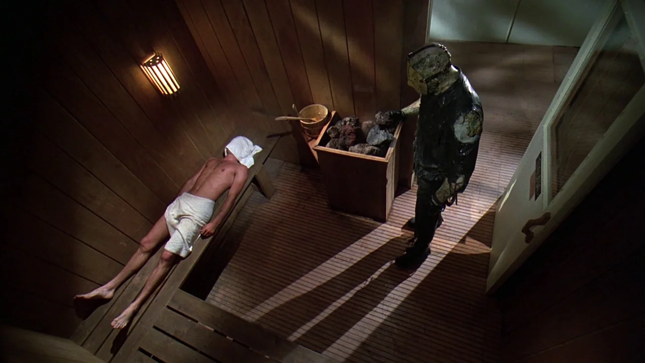 Friday the 13th Part VIII: Jason Takes Manhattan (1989) movie still: wide — A wooden paneled sauna features a heater filled with rocks and a wooden…