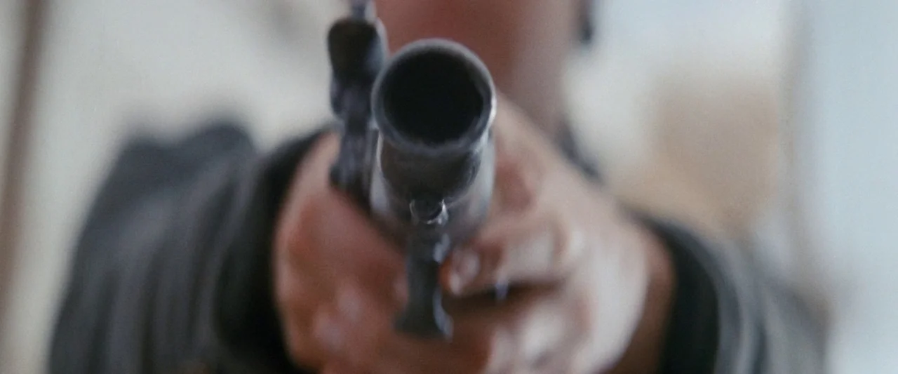 Once Upon a Time in China (1991) movie still: closeup — An interior space with out-of-focus background details suggesting a simple, unadorned room.…