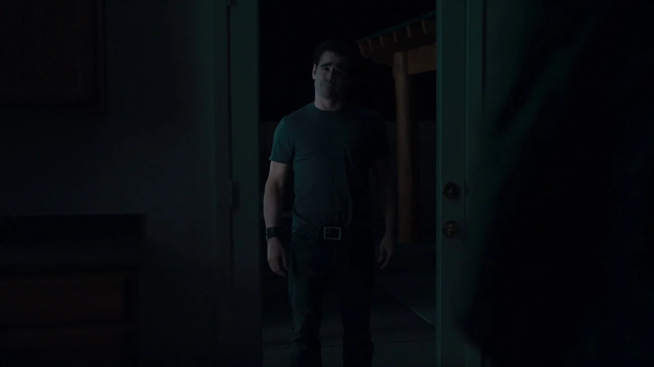 Fright Night (2011) movie still: medium — A man stands in an open doorway at night with a dark outdoor area behind him. The man is centered in the…