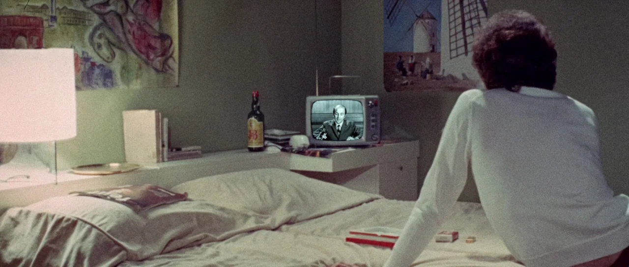 The Case of the Scorpion’s Tail (1971) movie still: medium — A 1970s bedroom features green walls, posters of a windmill, and a small television. A…