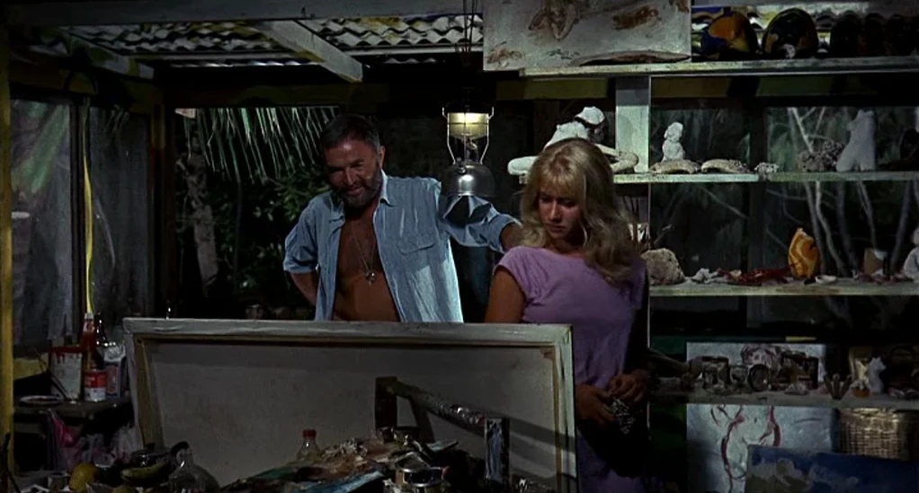 Age of Consent (1969) movie still: medium — An cluttered interior space with shelves displaying various sculptures and art supplies. A man and a…
