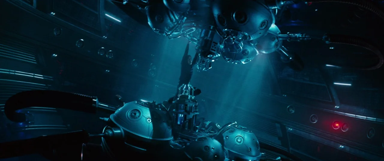 Star Trek Into Darkness (2013) movie still: wide — A dark spaceship chamber features large circular mechanical clusters suspended from the ceiling.…