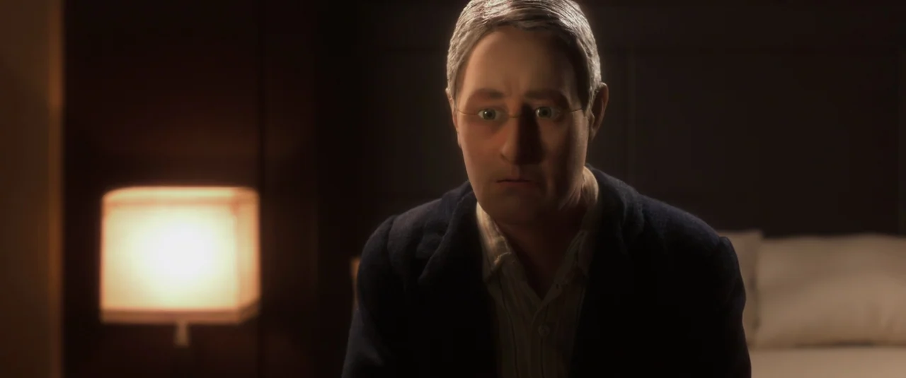 Anomalisa (2015) movie still: medium — A dimly lit room features a man sitting near a glowing bedside table lamp. The dark background shows a…
