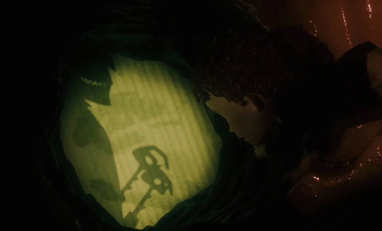 James and the Giant Peach (1996) movie still: medium — A dark subterranean space features a singular bright light source illuminating a circular…