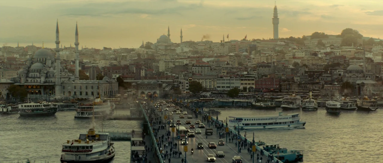 The Two Faces of January (2014) movie still: establishing — An expansive cityscape of Istanbul stretches across the horizon under a soft golden sky.…